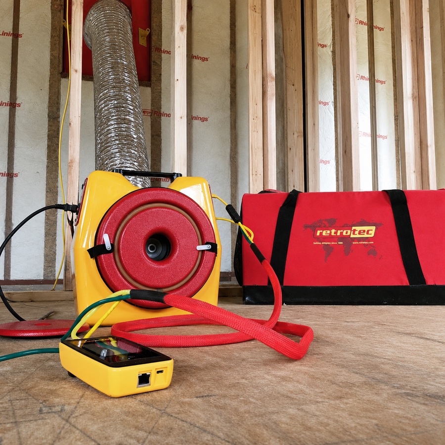 Duct Blaster fan and pressure gauge used for residential duct leakage testing